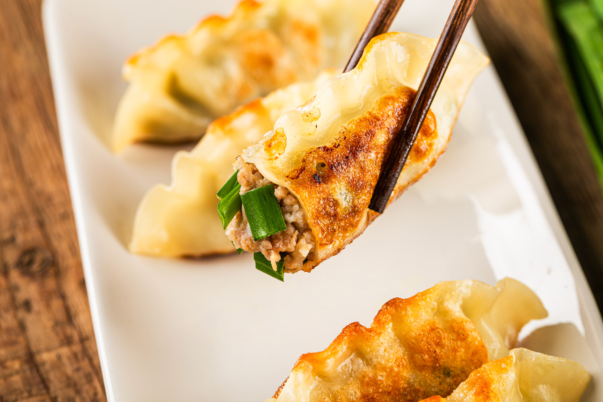 Making Chinese pork dumplings, also known as "Jiaozi," can be a fun and rewarding culinary experience. Here's a basic recipe to guide you through the process: